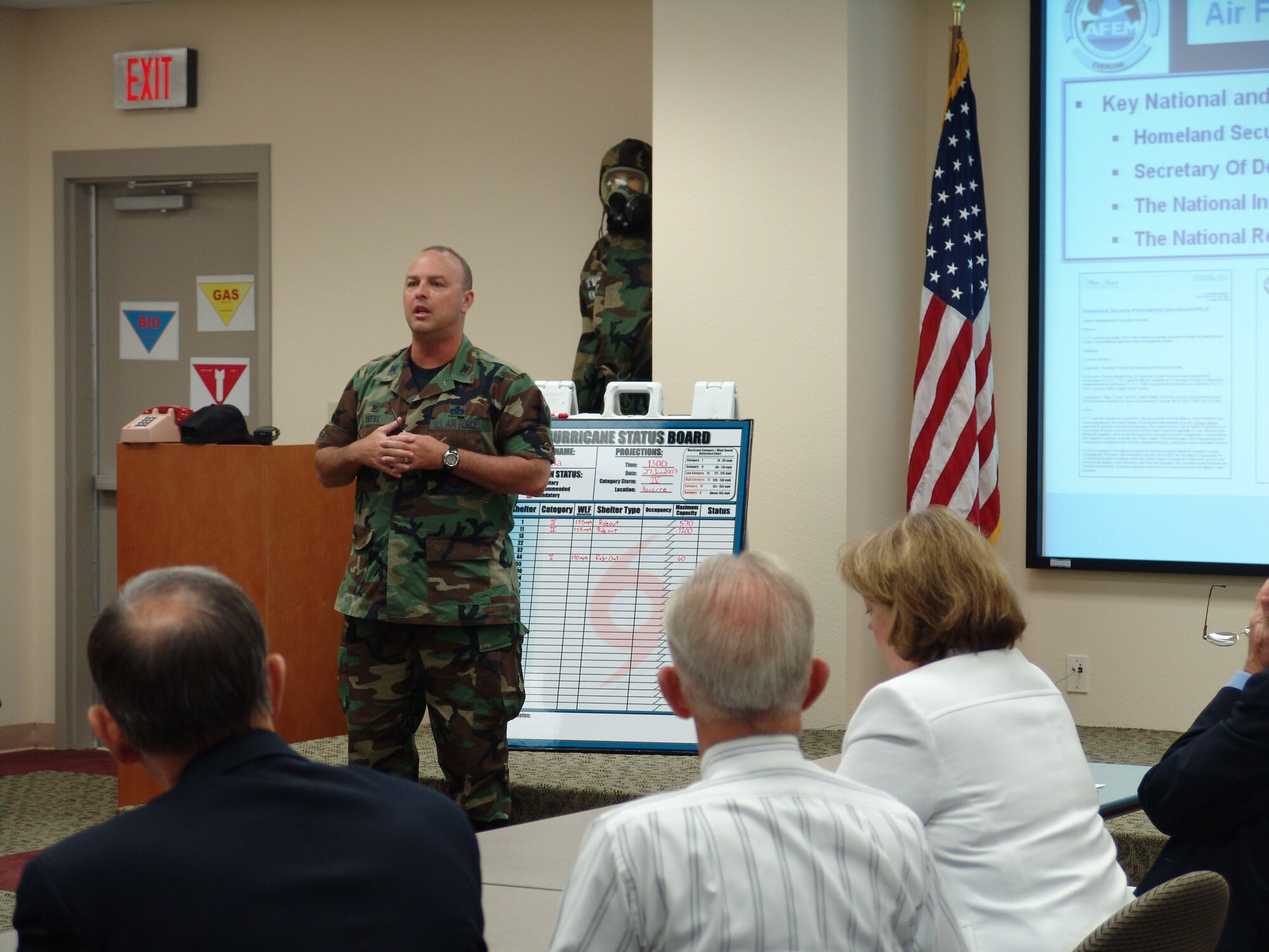 EGLIN AIR FORCE BASE, Fla.-- Col. Dennis Yates, 96th Civil Engineer Commander, briefs community leaders on the purpose of an Emergency Operation Center. The EOC was operational as the base participated in its annual hurrican exercise June 25 to 28. Col Yates was the EOC commander during the exercise. (USAF photo by Lois Walsh) 
