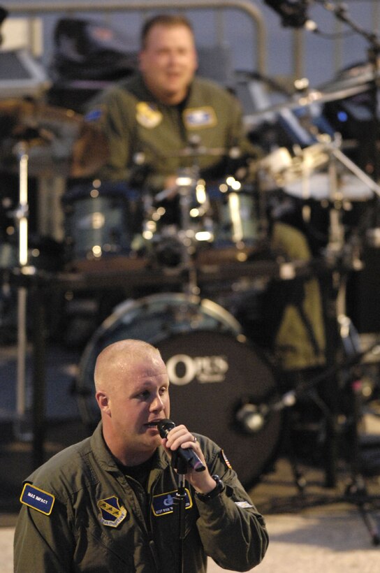 Master Sgt. Ryan Carson, U.S. Air Force Band vocalist, sings during a concert at the U.S. Capitol June 26.  The Band and the U.S. Air Force Honor Guard Drill Team performed together in an Air Force review. (U.S. Air Force photo by Senior Airman Dan DeCook)
