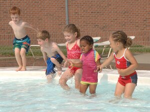 LANGLEY AIR FORCE BASE, Va. -- Preschoolers from the Russ Child Development center cool off at the Shellbank kiddie pool here June 26. Throughout the summer, children at the Russ Child Development Center take a number of field trips around Langley including walks to the bowling center, library, pool, arts and crafts center and Eagle Park. (U.S. Air Force Photo/Senior Airman Tabitha Kuykendall)