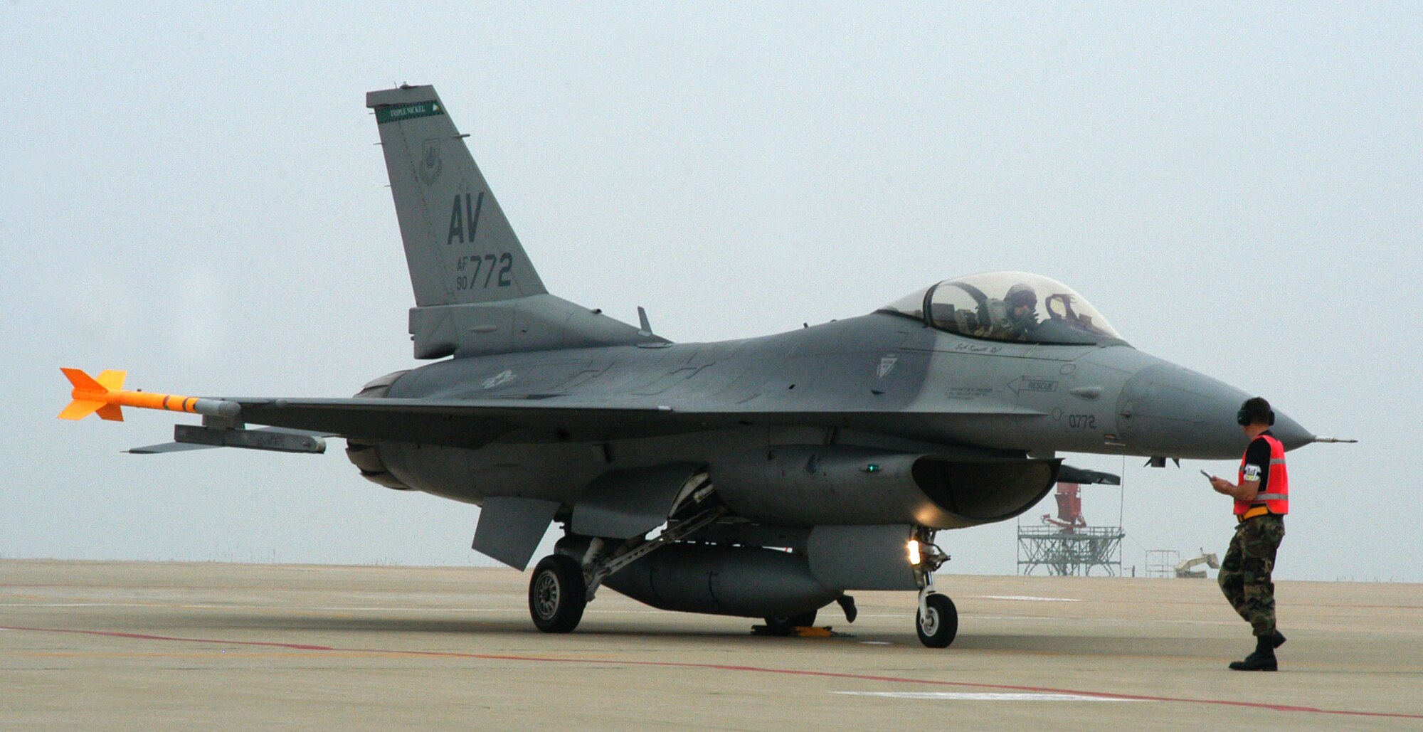 KUNSAN AIR BASE, Republic of Korea  -- Staff Sgt. Brett Myers, 555th Expeditionary Fighter Squadron weapons load team chief, performs a dearm of a "Triple Nickel" F-16 after a mission June 27.  Currently, more than five of the Aviano Air Base, Italy-assigned aircraft are deployed here with approximately 300 operations and maintenance personnel. The deployment signifies the United States' continued commitment to stability and security in the region. (U.S. Air Force photo/Senior Airman Stephen Collier) 