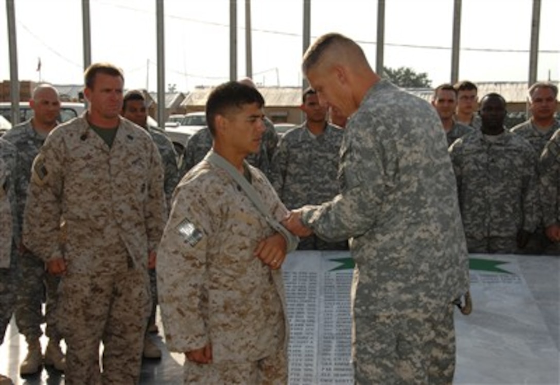 A U.S. Marine from Combined Joint Special Operations Task Force-Afghanistan is presented a Purple Heart by U.S. Army Maj. Gen. David Rodriguez, the commander of Combined Joint Task Force-82, at Bagram Airfield, Afghanistan, June 24, 2007.