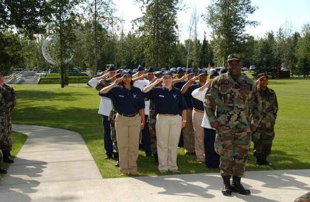 EIELSON AIR FORCE BASE, Alaska -- 354th Services Squadron renders a final salute to their commander, Maj. Alex Garcia, June 27 here. There are currently only six bases under structure of merging their Mission Support Squadrons and Services Squadrons into a Force Support Squadron; Eielson is the only one in Pacific Air Forces and is also the first to hold a change of command ceremony for this squadron. (U.S. Air Force photo by Airman 1st Class Christopher Griffin)