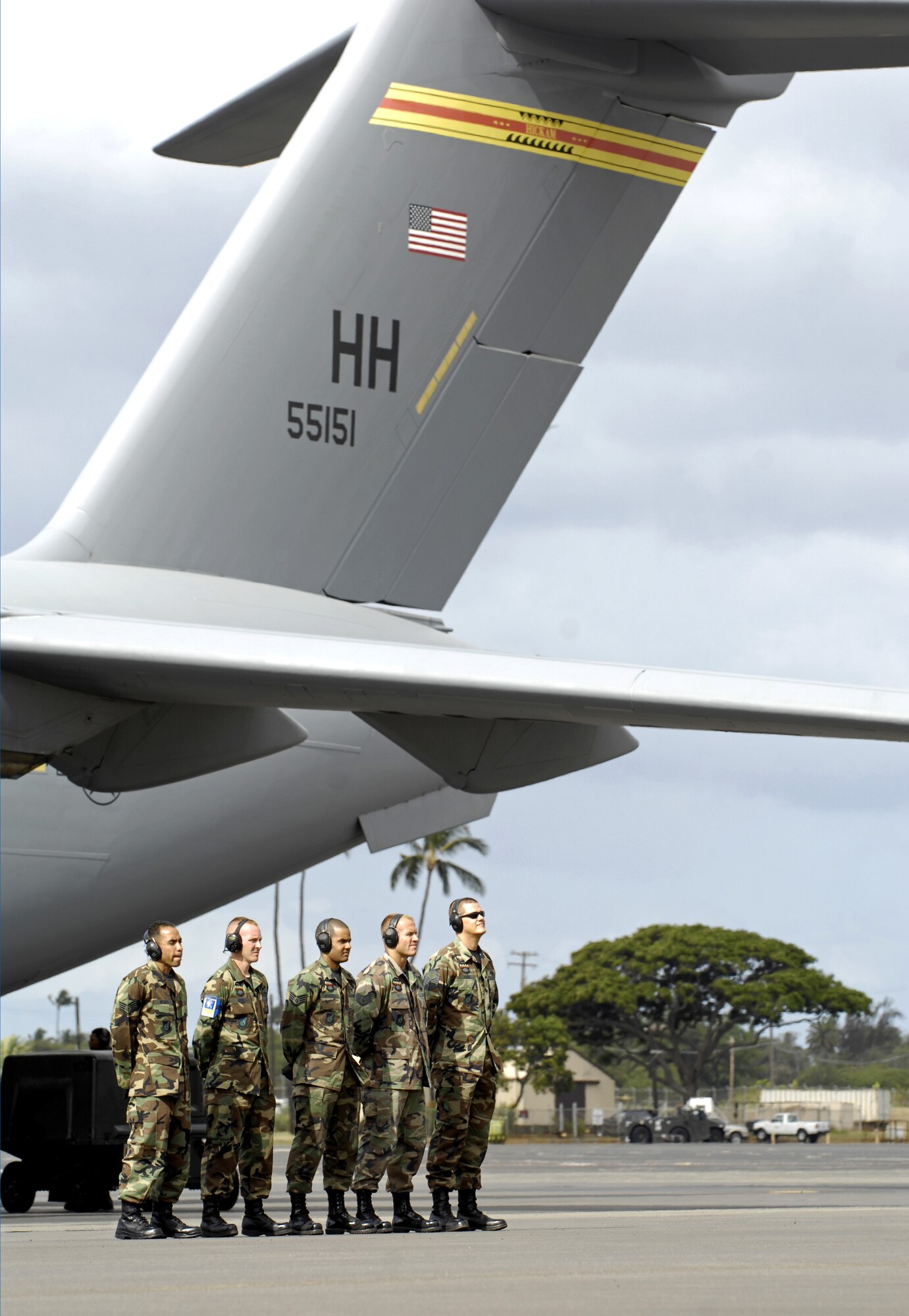 HICKAM AIR FORCE BASE, Hawaii -- Crew chiefs wait to launch a C-17 Globemaster III June 28. The Airmen, from the 15th Aircraft Maintenance Squadron, are practicing for the upcoming Air Mobility Command Rodeo at McChord Air Force Base, Wash. (U.S. Air Force photo/ Tech. Sgt. Shane A. Cuomo)