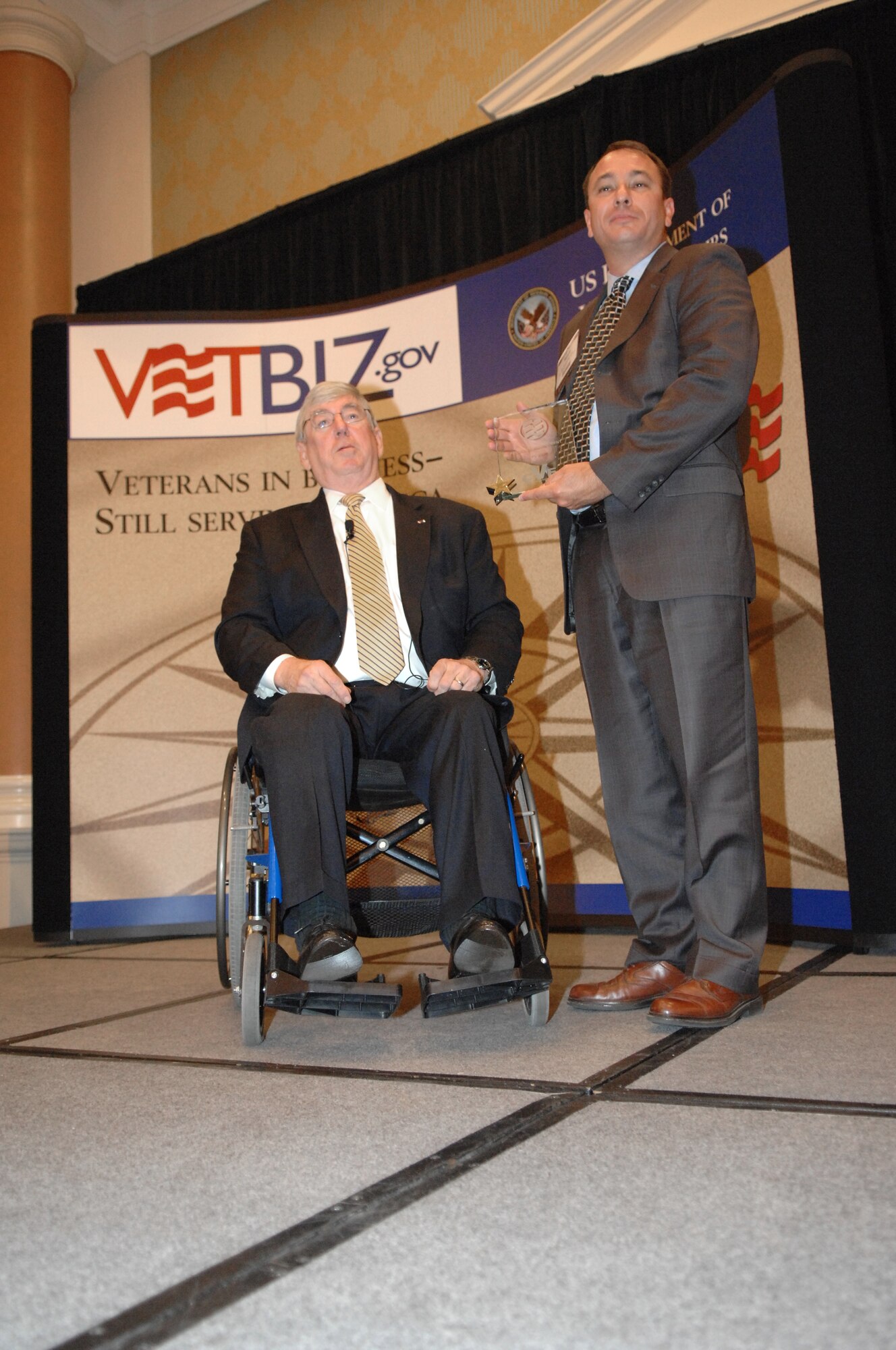 The Honorable Gordon H. Mansfield, Deputy Secretary of Veterans Affairs, presents the Air Force Award to Mr. Ronald A. Poussard, Director Air Force Office of Small Business Programs during the 6th Annual Awards Program Wednesday June 27 at Caesars Palace, Las Vegas, Nev.
(U.S Air Force Photo by Senior Airman Larry E. Reid Jr.) 