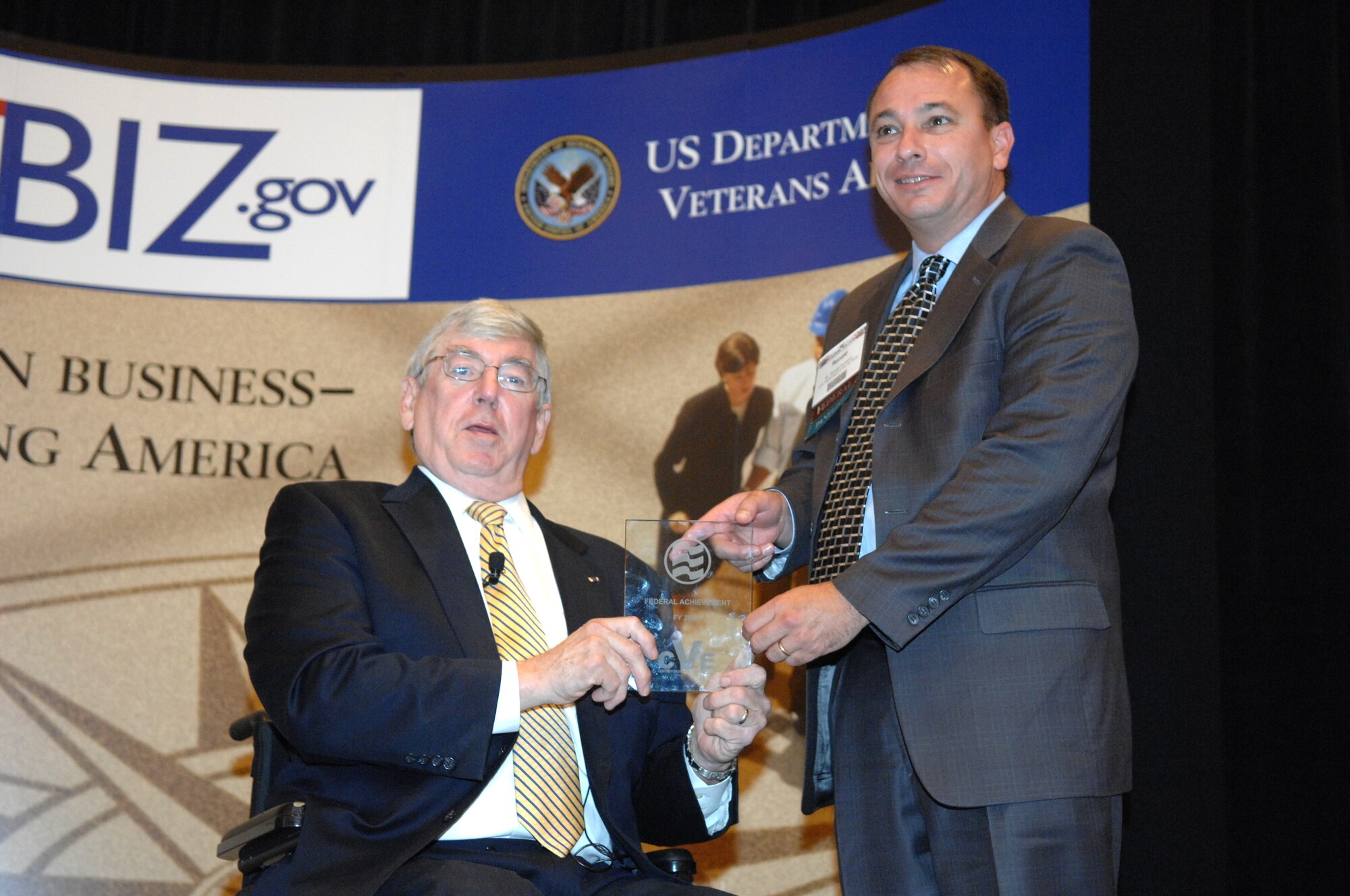 The Honorable Gordon H. Mansfield, Deputy Secretary of Veterans Affairs, presents the Air Force Award to Mr. Ronald A. Poussard, Director Air Force Office of Small Business Programs during the 6th Annual Awards Program Wednesday June 27 at Caesars Palace, Las Vegas, Nev.
(U.S Air Force Photo by Senior Airman Larry E. Reid Jr.) 
