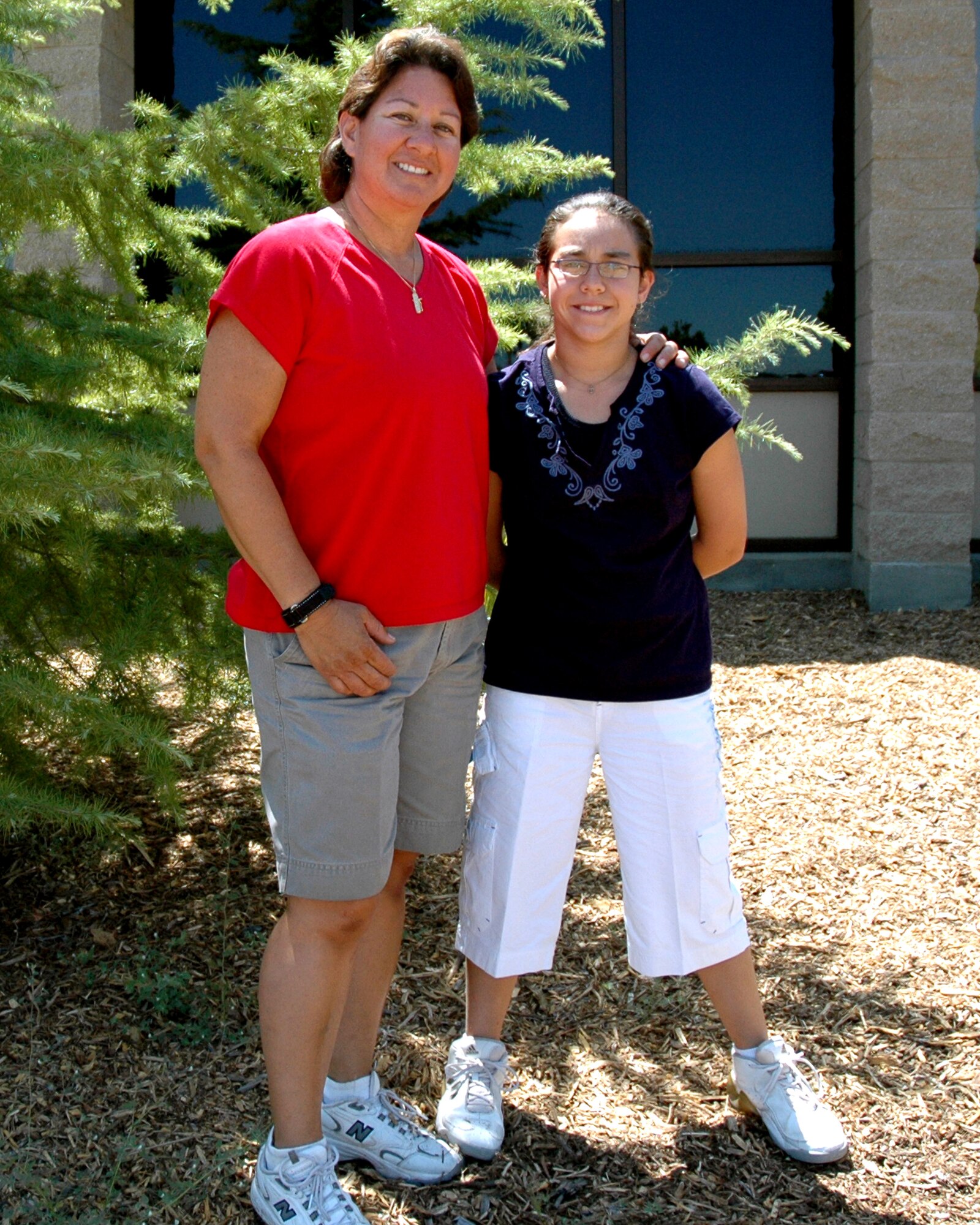 Air Force Reservist Tech.Sgt. Rebecca Garcia, an aircraft mechanic with the 940th Maintenance Group, poses proudly with daughter, Jordan, June 15, 2007 at Beale Air Force Base, Calif.  Jordan was the only student selected from her class to attend a young leaders conference in Washington, D.C. July 2007. (U.S. Air Force Photo/Master Sgt. Ellen L. Hatfield)
