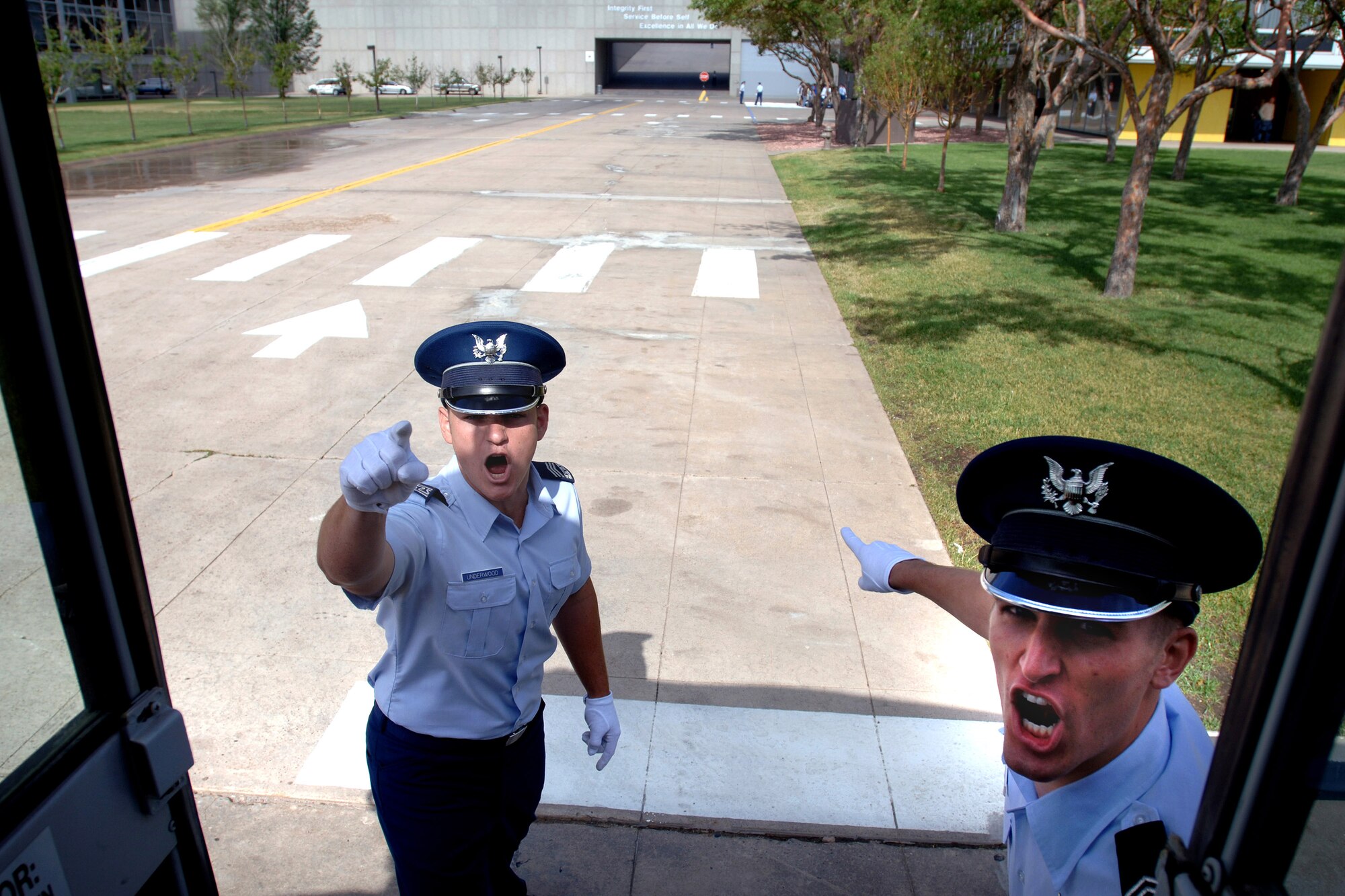 Basic cadet trainees meet inspiring upper classmen as they exit the bus to begin inprocessing as the Class of 2011 June 28 at the U.S. Air Force Academy in Colorado. The 1,304 members of the U.S. Air Force Academy's Class of 2011 arrived to inprocess and begin basic cadet training here. (U.S. Air Force photo/David Armer) 
