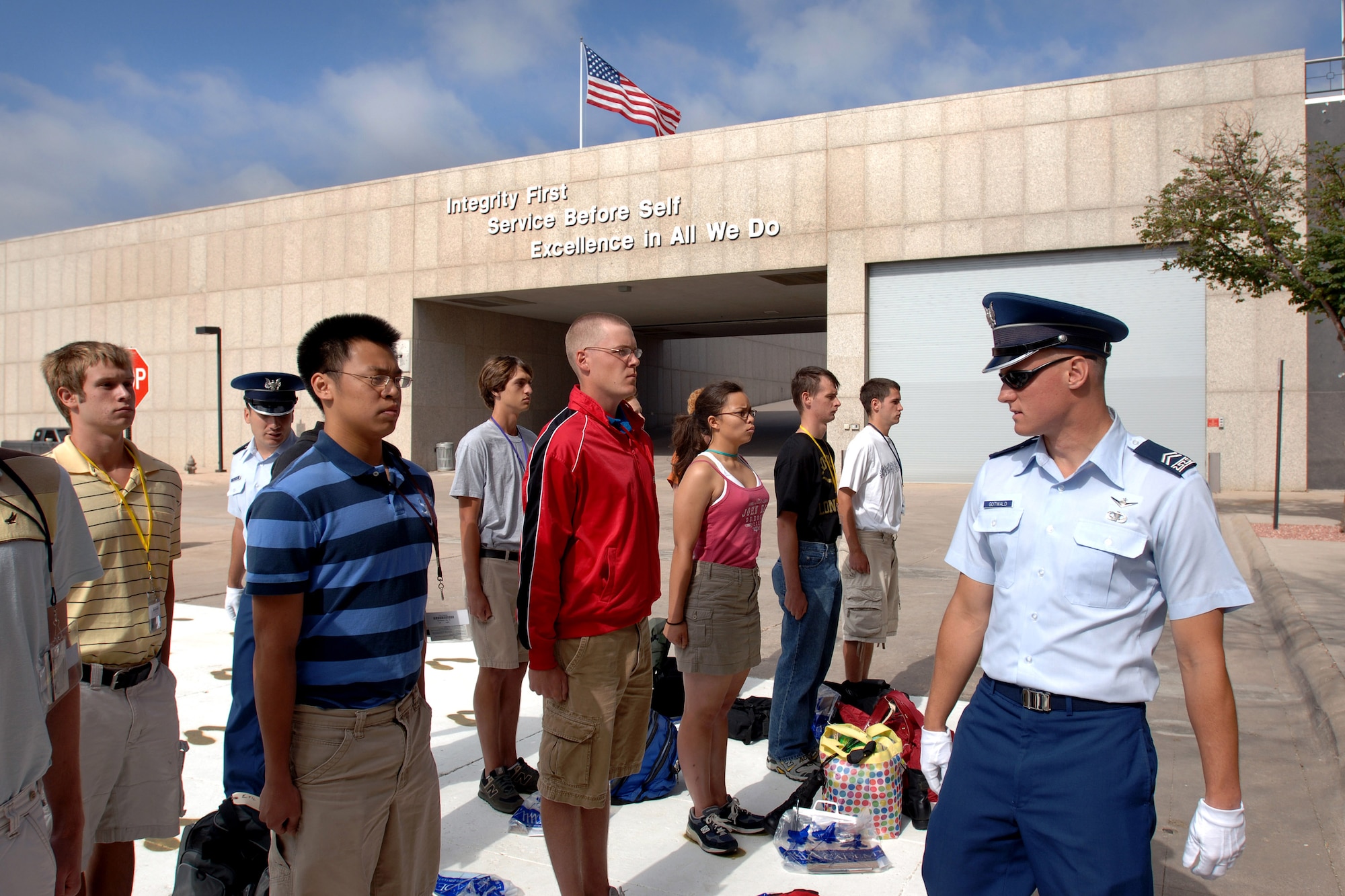 Cadet 2d Class Carl Gatwald inspects basic cadet trainees as they inprocess as the Class of 2011 June 28 at the U.S. Air Force Academy in Colorado. The 1,304 members of the U.S. Air Force Academy's Class of 2011 arrived to inprocess and begin basic cadet training here. (U.S. Air Force photo/David Armer) 
