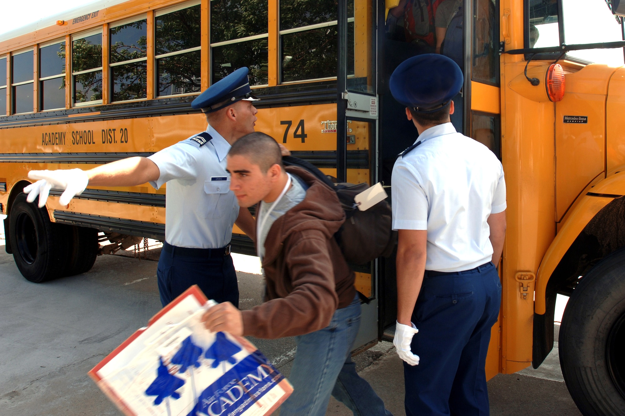Basic cadet trainees exit the bus as they begin inprocessing as the Class of 2011 June 28 at the U.S. Air Force Academy in Colorado. The 1,304 members of the U.S. Air Force Academy's Class of 2011 arrived to in-process and begin basic cadet training here. (U.S. Air Force photo/David Armer)

