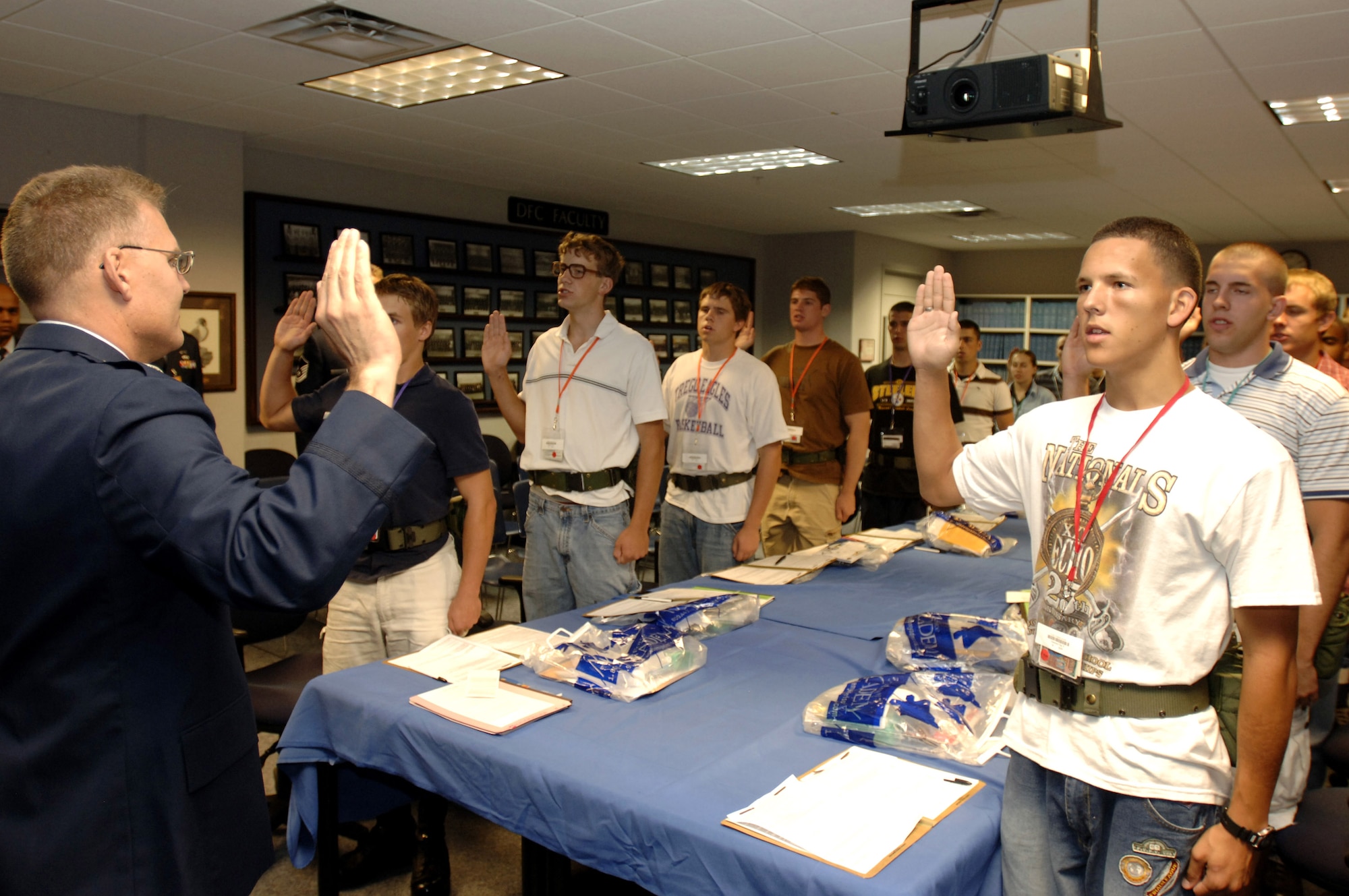Lt. Col. Alan Gladfelter administers the Oath of Allegiance to basic cadet trainees during inprocessing of the Class of 2011 June 28 at the U.S. Air Force Academy in Colorado. The 1,304 members arrived June 28 to begin basic cadet training. (U.S. Air Force photo/Mike Kaplan) 
