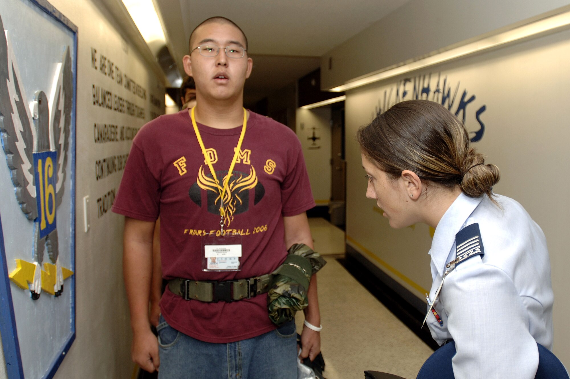 Basic Cadet Trainee Suong Hun Lee is inspected by Cadet 1st Class Katie Newkirk June 28 at the U.S. Air Force Academy in Colorado. The 1,304 members arrived June 28 to begin basic cadet training. Cadet Newkirk is the cadet squadron 31 commander. (U.S. Air Force photo/Mike Kaplan) 
