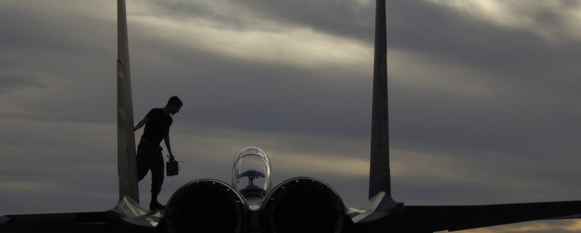MOUNTAIN HOME AIR FORCE BASE, Idaho -- Airman 1st Class Arthey Ortie from the 389th Aircraft Maintenance Unit works on a jet June 22.  The 389th AMU conducted flight regeneration for the phase one portion of a deployment exercise.  (Air Force photo/ Airman 1st Class Stephany Miller)    