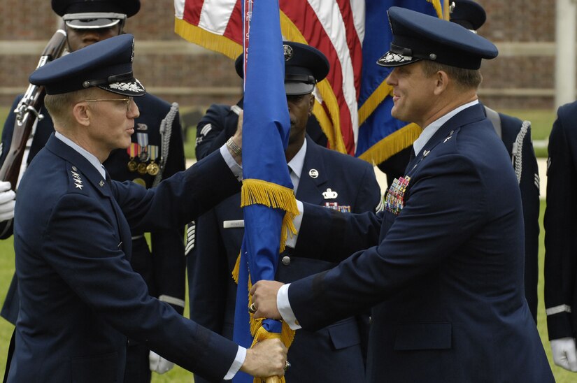 Gen. John D.W. Corley  (left), Air Force vice chief of staff, hands the Air Force District of Washington guidon, signifying command, to Brig. Gen. Frank Gorenc, the new AFDW commander, June 29 on the U. S. Air Force Ceremonial Lawn on Bolling during a combined retirement and change-of-command ceremony. General Gorenc replaces Maj. Gen. Robert L. Smolen, who retired after 33 years of military service. (U.S. Air Force photo by Senior Airman Dan DeCook)