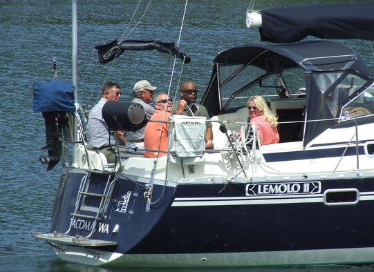 MCCHORD AIR FORCE BASE, Wash. -- Col. Shane Hershman, 62nd Airlift Wing vice commander, and his wife Gwen enjoy the sunshine at the Evergreen Fleet Cruise event at the Tacoma Yacht Club, June 20.  Dozens of generous community leaders donated their time and yachts for the annual cruise hosted by the Tacoma-Pierce County Chamber of Commerce, Tacoma Yacht Club and Harborstone Credit Union. 
(U.S. Air Force Photo/ Tech. Sgt. Carrie Bernard)
