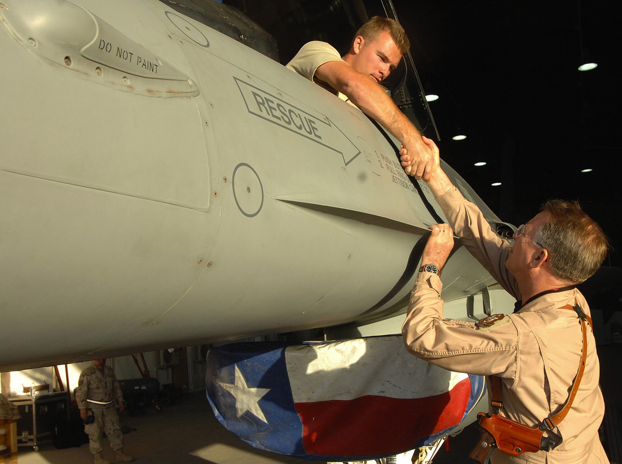 Lt. Gen. John Bradley, Commander, Air Force Reserve Command and Chief, Air Force Reserve stops by to visit with maintenance members deployed from the 301st Fighter Wing out of the Naval Air Station Joint Reserve Base Fort Worth, Texas. General Bradley visited Airmen throughout Southwest Asia to thank them for their service supporting the Global War on Terror. (U.S. Air Force Tech. Sgt. Rick Sforza) (RELEASED)