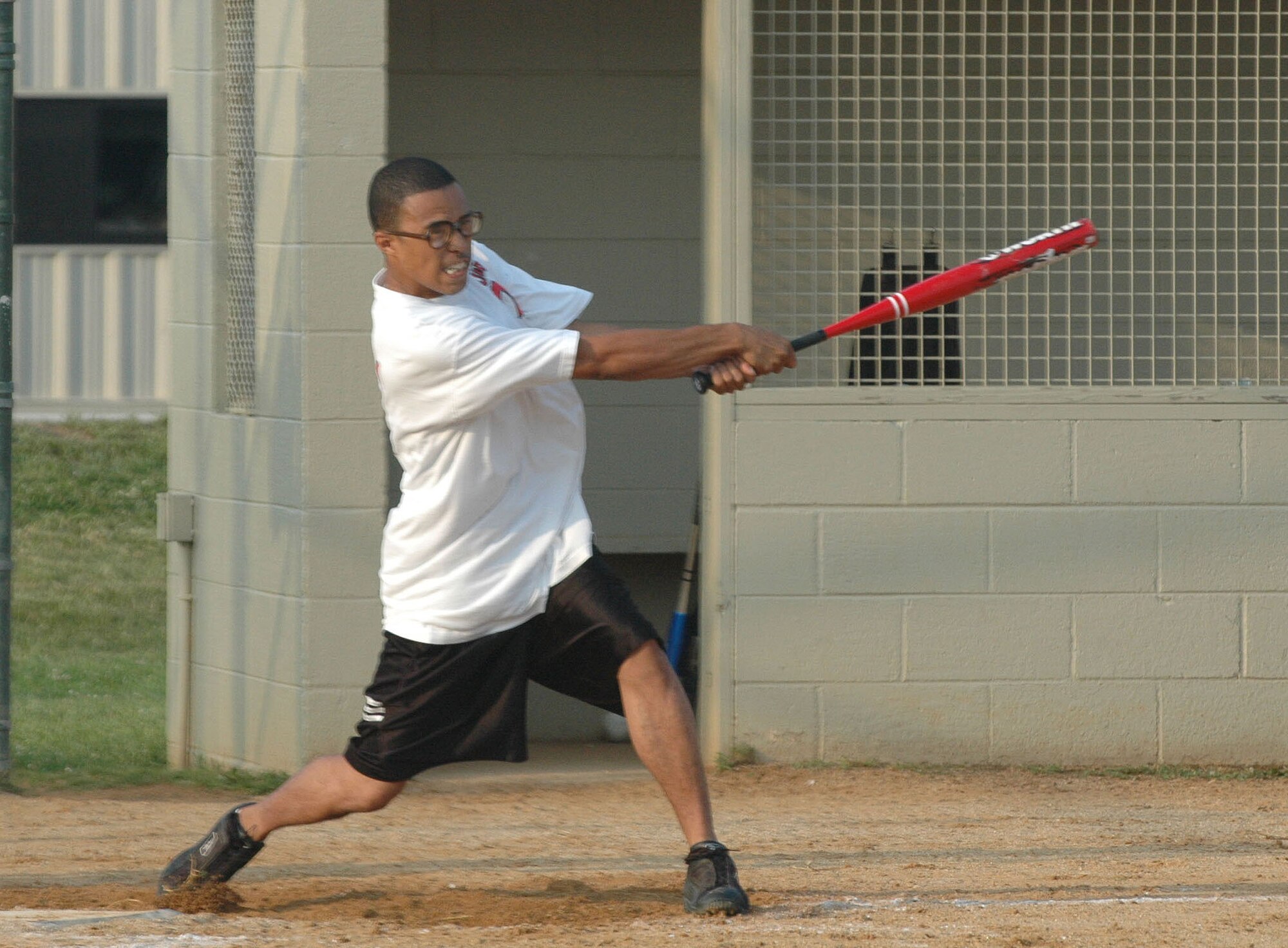 DOVER AIR FORCE BASE, Del. -- Jason Jones, 512th Operations Group, pummels the ball to help the reservists' softball team pound the 9th Airlift Squadron June 25 23-8. The Liberty Wing won with a whopping three home runs over five innings invoking the mercy rule. (U.S. Air Force photo/Senior Airman Andria J. Allmond)