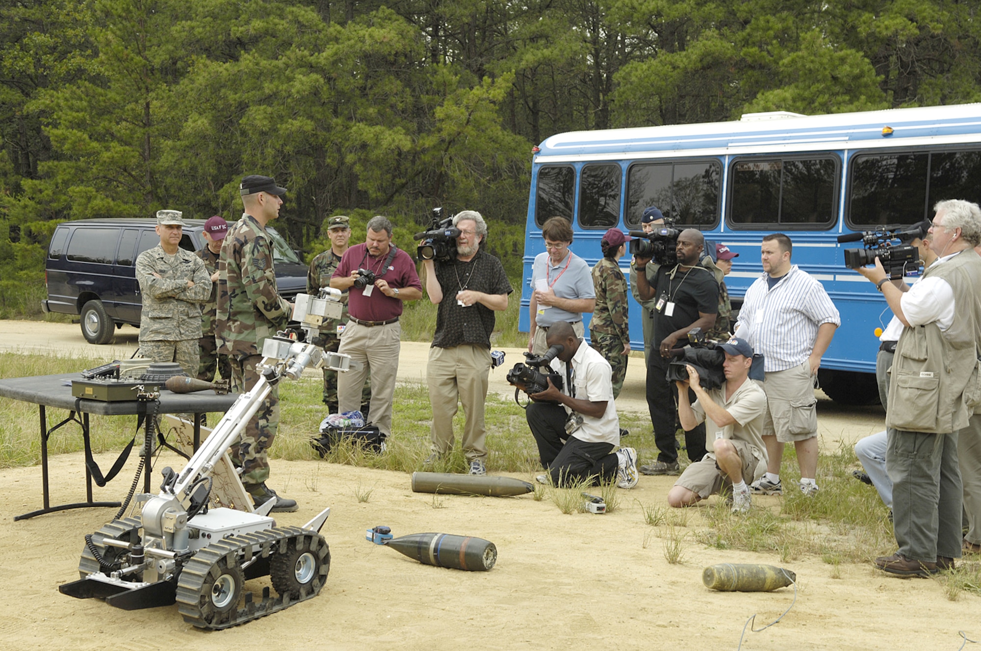 Staff Sgt. Mike Tesch, 421st Combat Training Squadron explosive ordnance instructor, briefs media on improvised explosive device training at Naval Air Engineering Station Lakehurst. Several media outlets visited McGuire for a glimpse of Team McGuire's mission, including a tour of "Eagle Flag", and briefings from Team McGuire commanders focusing on the importance of missions, joint basing and Team McGuire integration. The goal of the tour was to educate media representatives on Air Force capabilities and the base’s missions. (U.S. Air Force photo by Kenn Mann) 