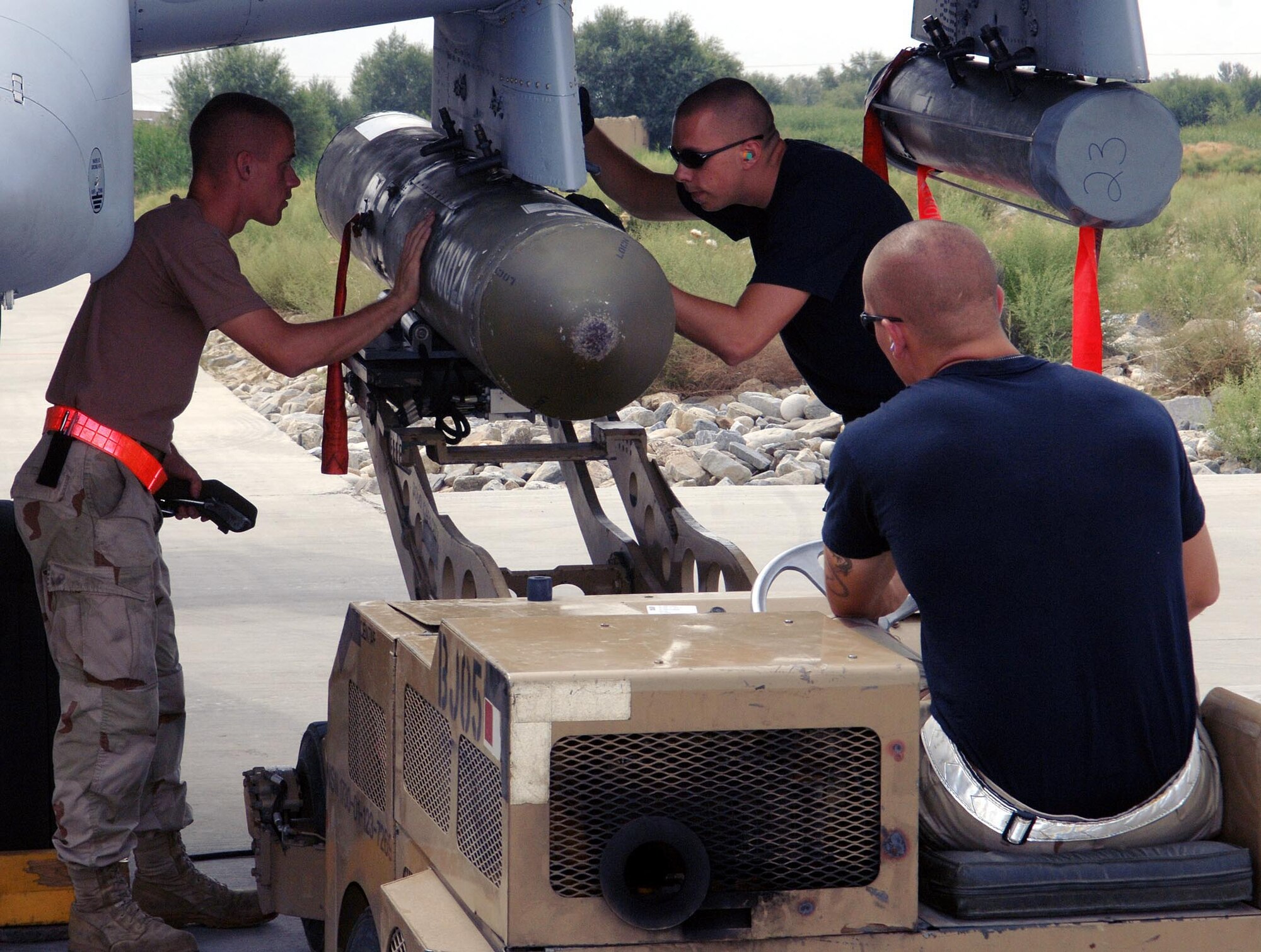 Airmen from the 354th Expeditionary Aircraft Maintenance Unit unload ordnance from an A-10 at Bagram Airfield, Afghanistan. The A-10 is one of two different aircraft assigned here providing close air support to troops on the ground. (U.S. Air Force photo by Staff Sgt. Craig Seals)