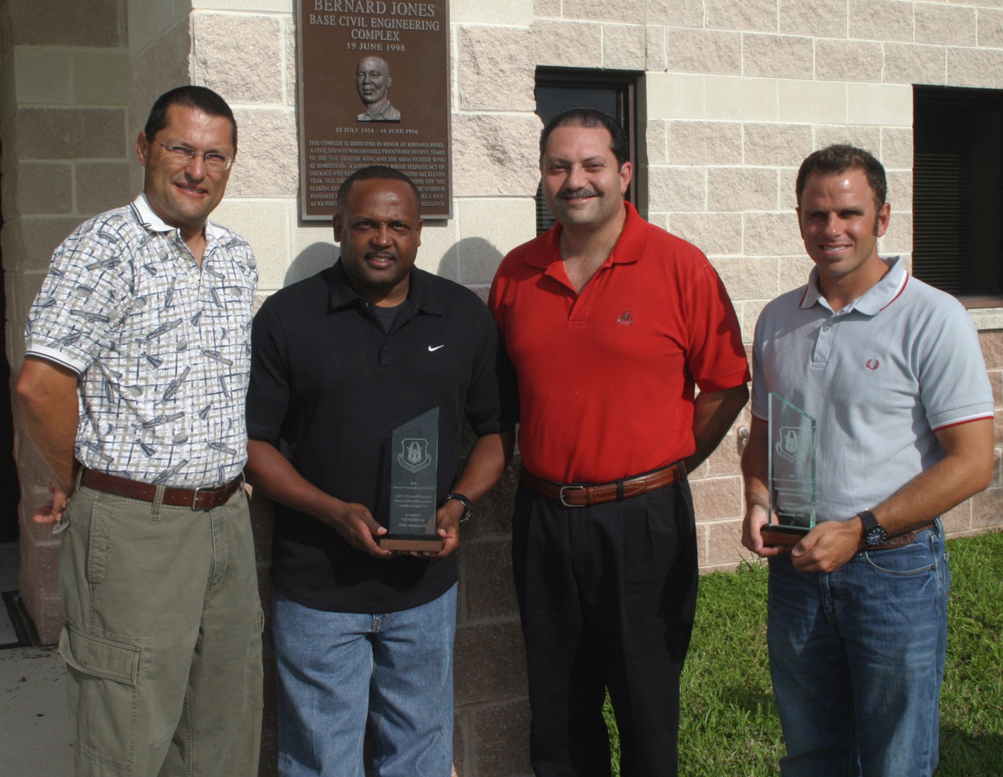 Members of the 482nd Civil Engineering Squadron Environmental Flight display their most recent award, the General Thomas D. White Pollution Prevention Award for Team Excellence.  The team also won the General Thomas D. White Restoration Award for Team Excellence.  Both awards are heavily focused on cleaning up or preventing pollution of Air Force property and surrounding communities.  Pictured left to right are:  Tony Cedeno, Lavaughn Berry, Larry Ventura and Rob Vespe.  (U.S. Air Force photo/Tech. Sgt. Paul Dean)