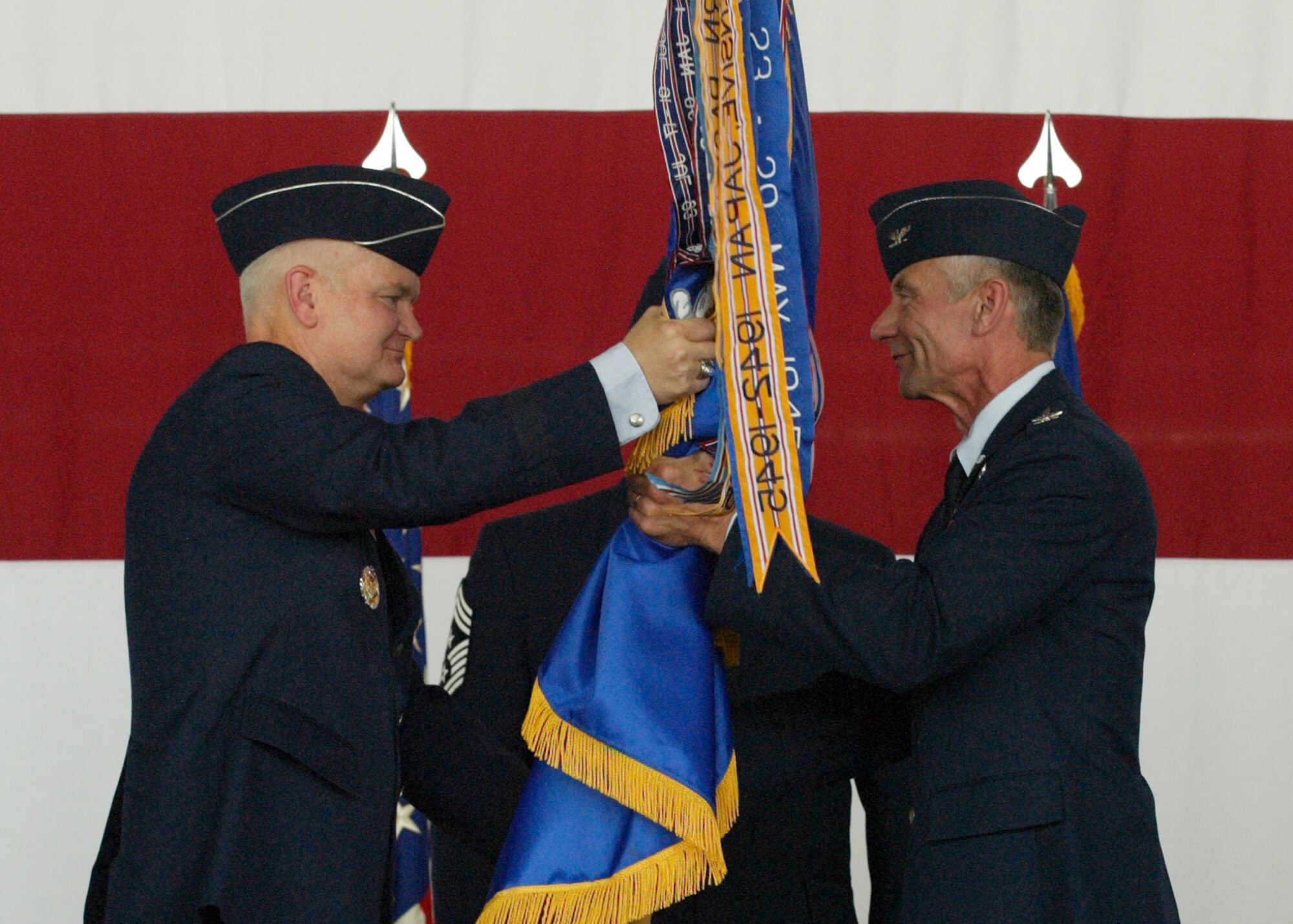 Col. Philip McDaniel, right, assumes command of the 39th Air Base Wing from Lt. Gen. Robert Bishop, 3rd Air Force commander, officiating officer during the Change of Command Ceremony June 29 in Hangar 4.  (U. S. Air Force Photo by Ismael Gomez)(RELEASED)