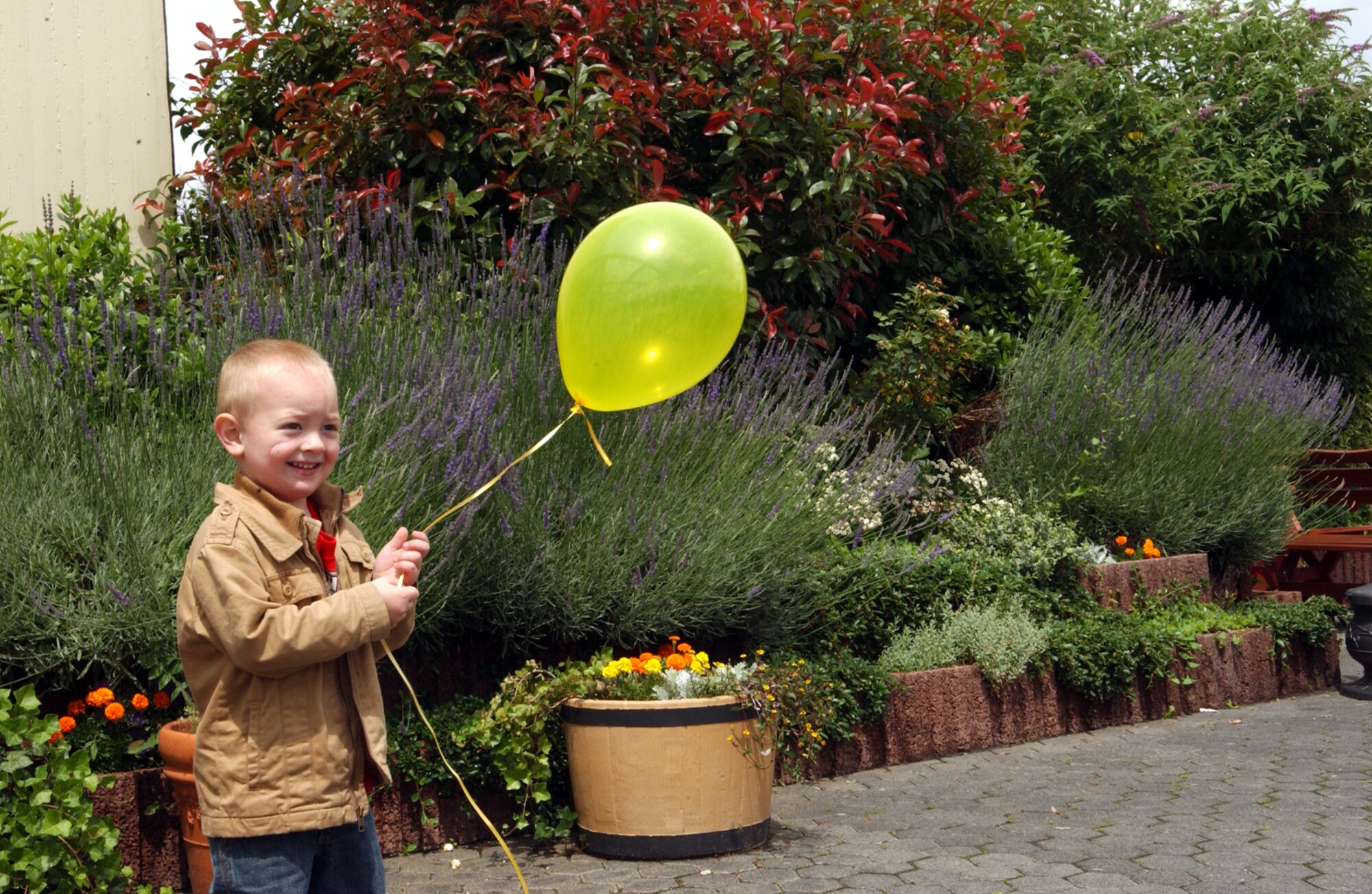 SPANGDAHLEM AIR BASE, Germany -- Riley Astore, son of Sarah Crider, prepares to release a balloon with information on the missing gilr madeleine attached to the bottom of the string on June 22, The date marked 50 days since young Madeleine McCann went missing. People from all over the world held similar events to show their support for Madeleine’s family. (US Air Force photo/Airman 1st Class Allen Pollard)                              