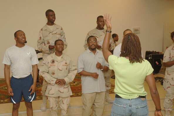 Members of the Desert Eagle Team sing at Gospel Choir Practice July 23. The 379th Air Expeditionary Wing chapel hosts about 80 services reaching thousands of expeditionary Airmen, Soldiers, Sailors, Marines and civilians in theater. (U.S. Air Force photo by Master Sgt. Ken Stephens)