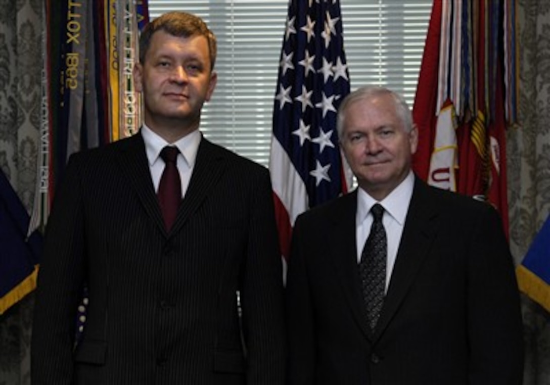 Secretary of Defense Robert M. Gates welcomes Latvian Minister of Defense Atis Slakteris to the Pentagon, June 29, 2007.