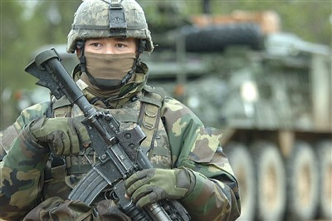U.S. Army Sgt. Richard Boone maintains a security perimeter around a Stryker Infantry Carrier Vehicle during Exercise Talisman Sabre 2007 in Shoalwater Bay, Australia, on June 23, 2007.  The biennial exercise is designed to train Australian and U.S. forces in planning and conducting combined task force operations that help improve combat readiness and interoperability.  Boone is assigned to Alpha Company, 1st Battalion, 5th Infantry Regiment.  