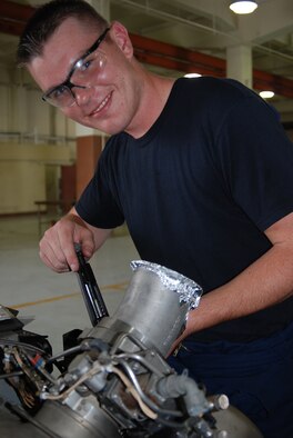 Airman 1st Class Kyle Thomas, 36th Maintenance Squadron aerospace ground equipment mechanic, saved a seven-year-old child?s life at a Norman, Okla., bowling alley while on leave before flying to his first duty station here on Andersen. Airman Thomas received an Achievement Medal for performing the Heimlich maneuver, which he learned in basic military training to eject candy that was lodged in the child?s throat, causing him to choke. (Photo by Senior Airman Angelique Smythe/36th Wing Public Affairs)  