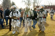 FAIRCHILD AIR FORCE BASE, Wash. -- On Feb. 21, the 92nd Air Refueling Wing held an exercise to evaluate base readiness and the wing’s ability to react appropriately to an emergency. Here, the 92nd Civil Engineer Squadron fire team performs a walk-through during a simulated car bombing scenario. (Photo by Senior Airman Jessica Fuentez)
