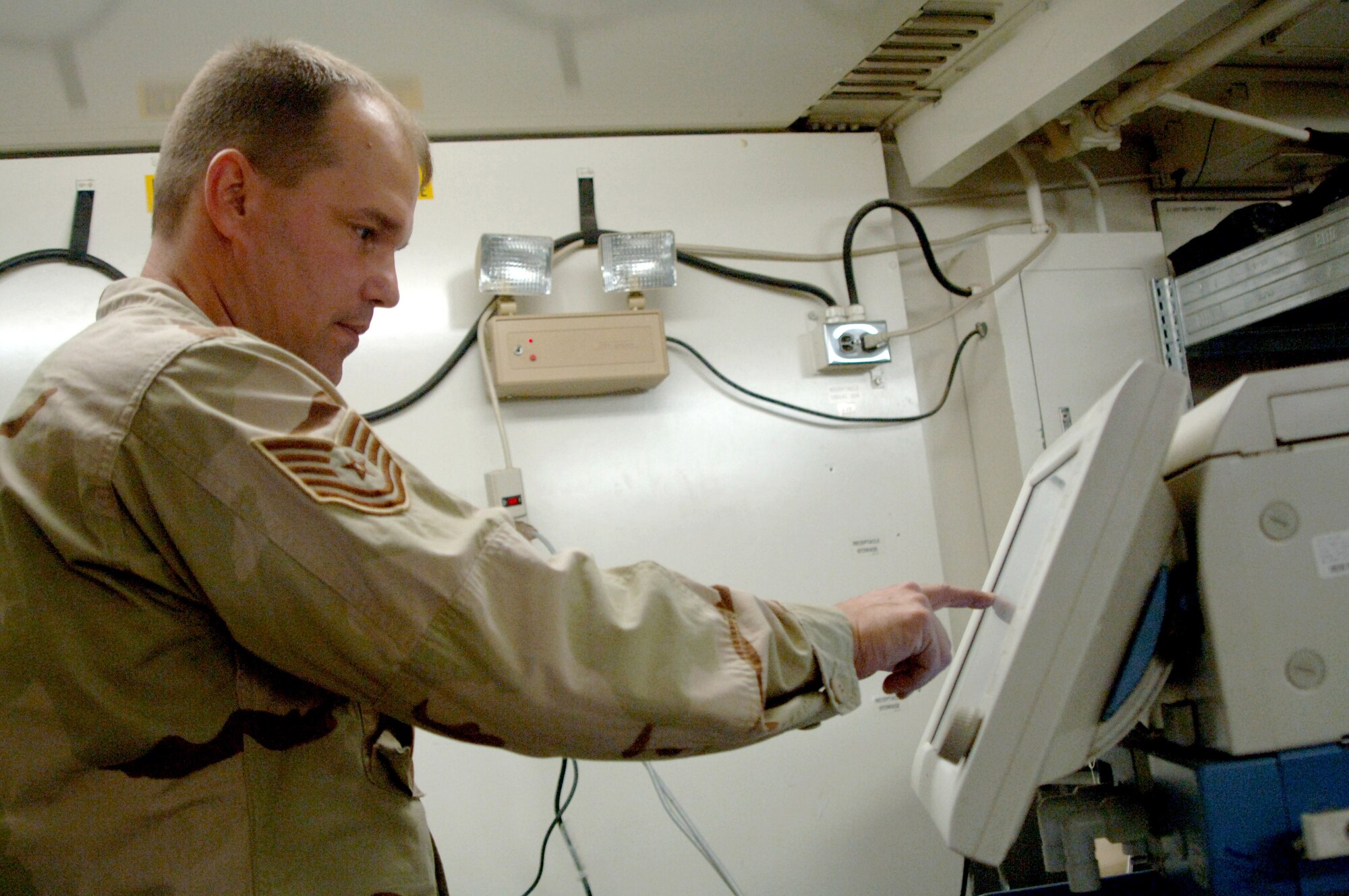 Tech. Sgt. Wayne Sinclair performs an operational inspection on a ventilator Feb. 21 in the biomedical equipment repair shop at  Balad Air Base, Iraq. It can take Sergeant Sinclair a full duty day to monitor, inspect and follow the manufacturer's specifications guide on the ventilator. Sergeant Sinclair is assigned to the 332nd Expeditionary Medical Group and is deployed from the 56th Medical Support Squadron at Luke Air Force Base, Ariz. (U.S. Air Force photo/Senior Airman Candace Romano) 
