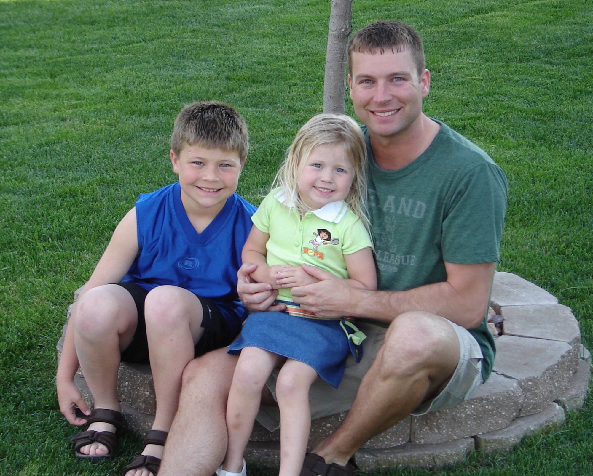 Master Sgt. James Morbach and his two children, Kyle, 9, and Alyssa, 5, pose for a family portrait. Sergeant Morbach is a first sergeant assigned to the 732nd Expeditionary Security Forces Squadron at Balad Air Base, Iraq. He is a Nebraska Air National Guard member assigned to the 155th Air Reserve Wing. (Courtesy photo) 
