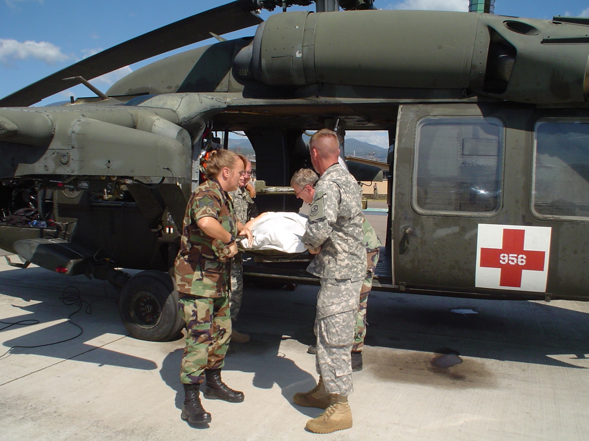 U.S. military personnel
load a patient onto a UH-60 Black Hawk helicopter Feb. 6.   (U.S. Air Force Photo by U.S. Air Force Capt. Alysia Harvey)
