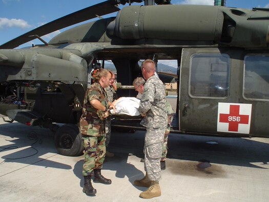 U.S. military personnel
load a patient onto a UH-60 Black Hawk helicopter Feb. 6.   (U.S. Air Force Photo by U.S. Air Force Capt. Alysia Harvey)
