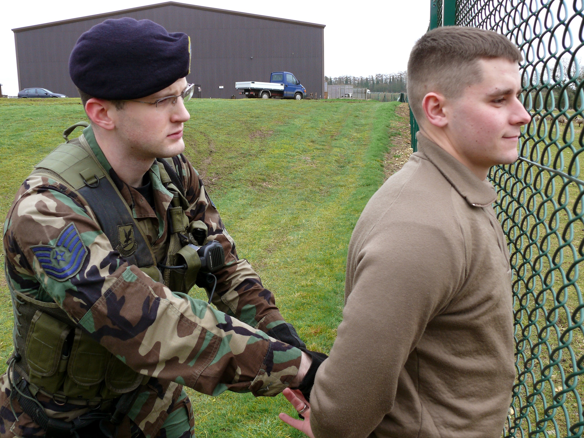 Tech. Sgt. Dustin Schimp participates in an exercise Feb. 27 at Royal Air Force Croughton, United Kingdom. As a combat arms specialist for the 434th Security Forces Squadron, he apprehended the simulated suspect after a short chase. Sergeant Schimp is a reservist from Indiana augmenting the 422nd Security Forces Squadron at RAF Croughton on an 18-month deployment. (U.S. Air Force photo/Tech Sgt. Scott Wakefield)
