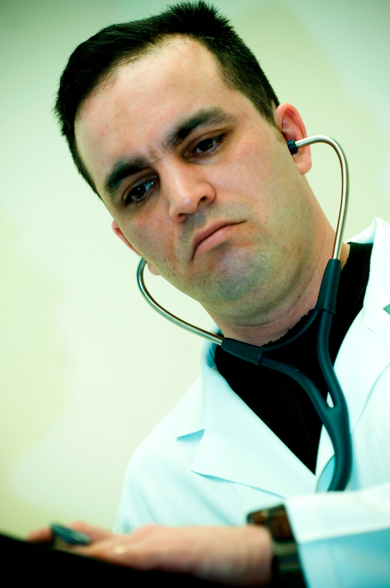 ELMENDORF AIR FORCE BASE, Alaska - Master Sgt. Kory Rivera listens to sounds in a patient's chest during a routine check-up. Sergeant Rivera is the NCOIC of the 3rd Medical Group Women's Health Services Flight. Sergeant Rivera was selected to receive the Air Force Association "expeditionary medics" 2007 Team of the Year Award and will represent the Pacific Air Force along with six other airmen at a ceremony in Washington D.C. April 3. (U.S. Air Force photo by Senior Airman Garrett Hothan)