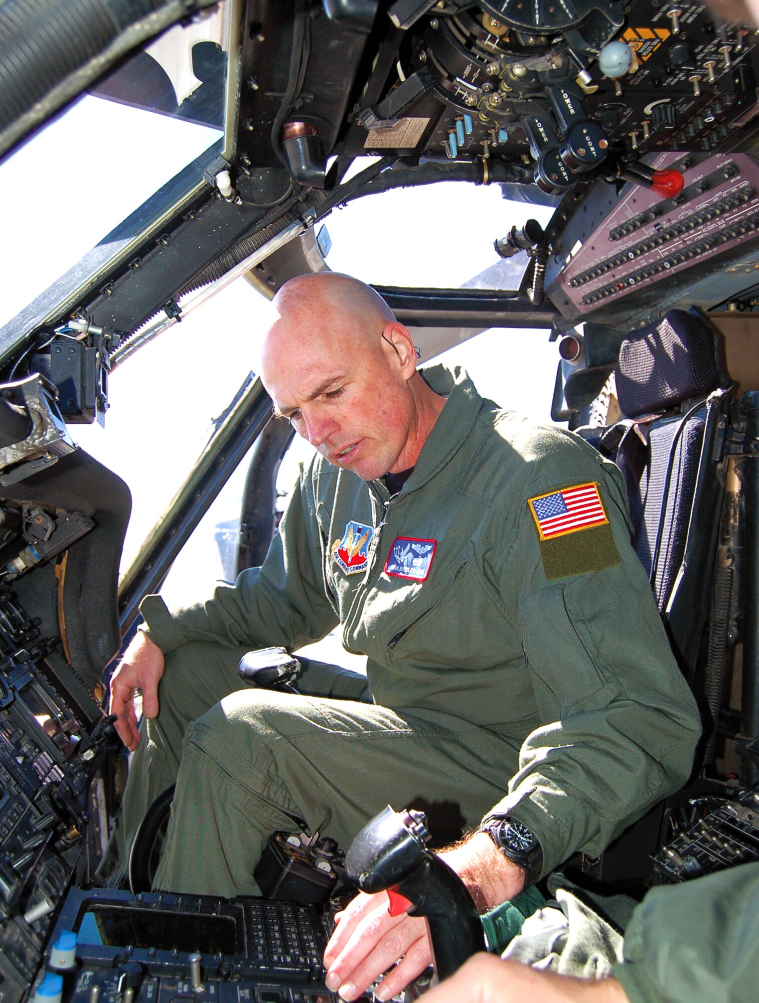 Master Sgt. John Buckler, HH-60G Pave Hawk flight engineer, inspects cockpit switches of his helicopter prior to his first flight Feb. 22. Sergeant Buckler was diagnosed with cancer in 2005 and after his successful treatment, spent two years appealing to medical boards to allow him back onto flight status.  (U.S. Air Force photo by Tech. Sgt. Parker Gyokeres)

