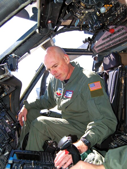 Master Sgt. John Buckler, HH-60G Pave Hawk flight engineer, inspects cockpit switches of his helicopter prior to his first flight Feb. 22. Sergeant Buckler was diagnosed with cancer in 2005 and after his successful treatment, spent two years appealing to medical boards to allow him back onto flight status.  (U.S. Air Force photo by Tech. Sgt. Parker Gyokeres)
