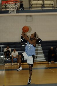 Gregory Ford of the 1st Medical Group makes a lay-up after a steal against the 1st Equipment Maintenance Squadron at the Shellbank Fitness Center, here, Feb. 23. Ford led all players with 19 points, as he and the MDG won the intramural under 35 basketball Championship.