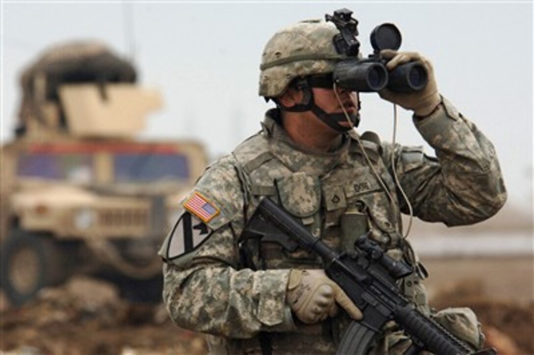 U.S. Army Pfc. Jason Dore looks for any possible enemy contact in western Baghdad, Iraq, on Feb. 22, 2007.  Dore is assigned as a forward observer with the 2nd Battalion, 5th Cavalry Regiment, 1st Cavalry Division.  