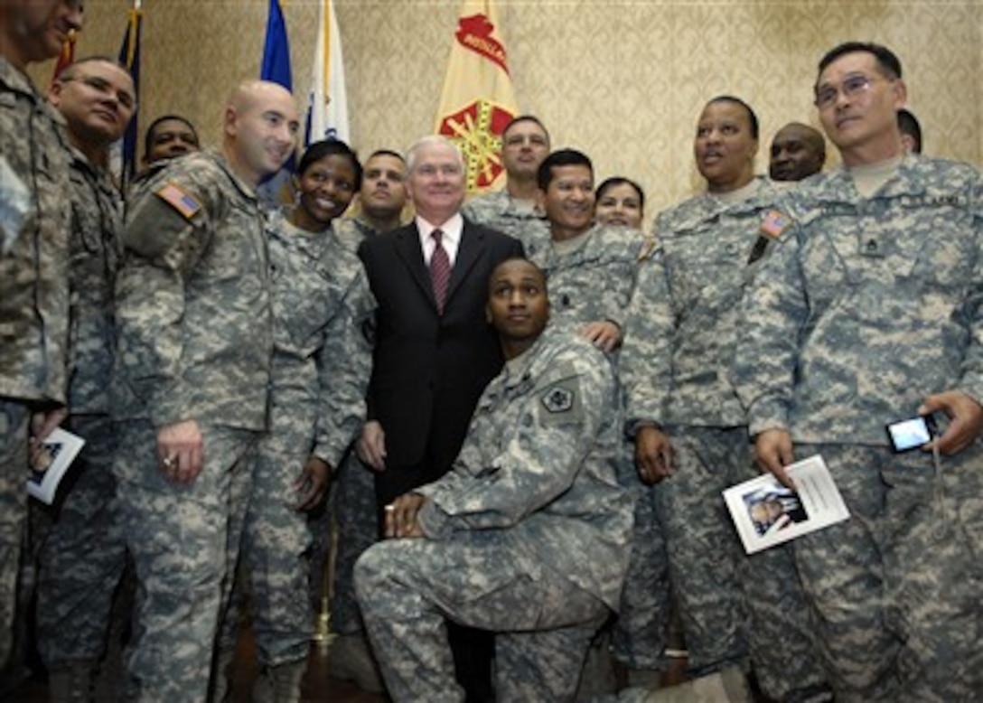 Secretary of Defense Robert M. Gates (center) meets with Army Non- Commissioned Officers after a breakfast meeting at Ft. Belvoir, Va., on March 1, 2007.  Gates delivered brief remarks and then addressed questions and concerns from the troops.   