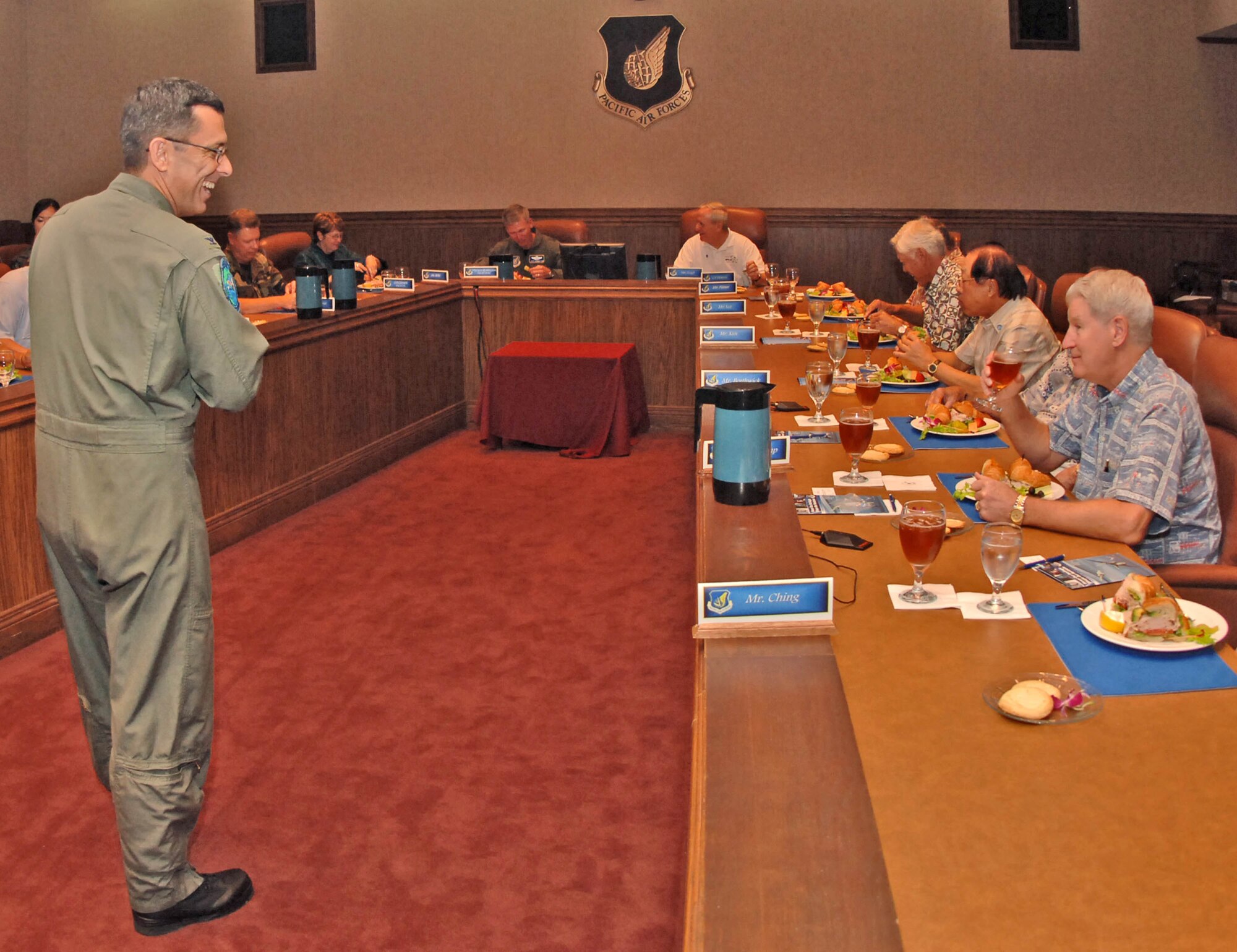 HICKAM AIR FORCE BASE, Hawaii -- Col. Rojo Herrera (left), Air Force Week Honolulu project officer, and Maj. Gen. Jeffrey Remington (far back), director of Air, Space and Information Operations, Plans and Requirements, Headquarters Pacific Air Forces (PACAF), provided the year's first quarterly PACAF update briefing to the Air Force Civilian Advisory Council. The general's operations update focused on the Pacific including the F-22 deployment to Kadena AB, Japan; Red Flag Alaska; the capability of the C-17; and Global Hawks on Guam. Col. Herrera discussed Air Force Week events occurring 12-15 Sept., including a Thunderbirds flight demonstration off Waikiki beach.

The council is made up of 40 of Honolulu's influential civic leaders and serves in an advisory capacity to the commander of PACAF.  (U.S. Air Force photo by Vanessa Perez)
