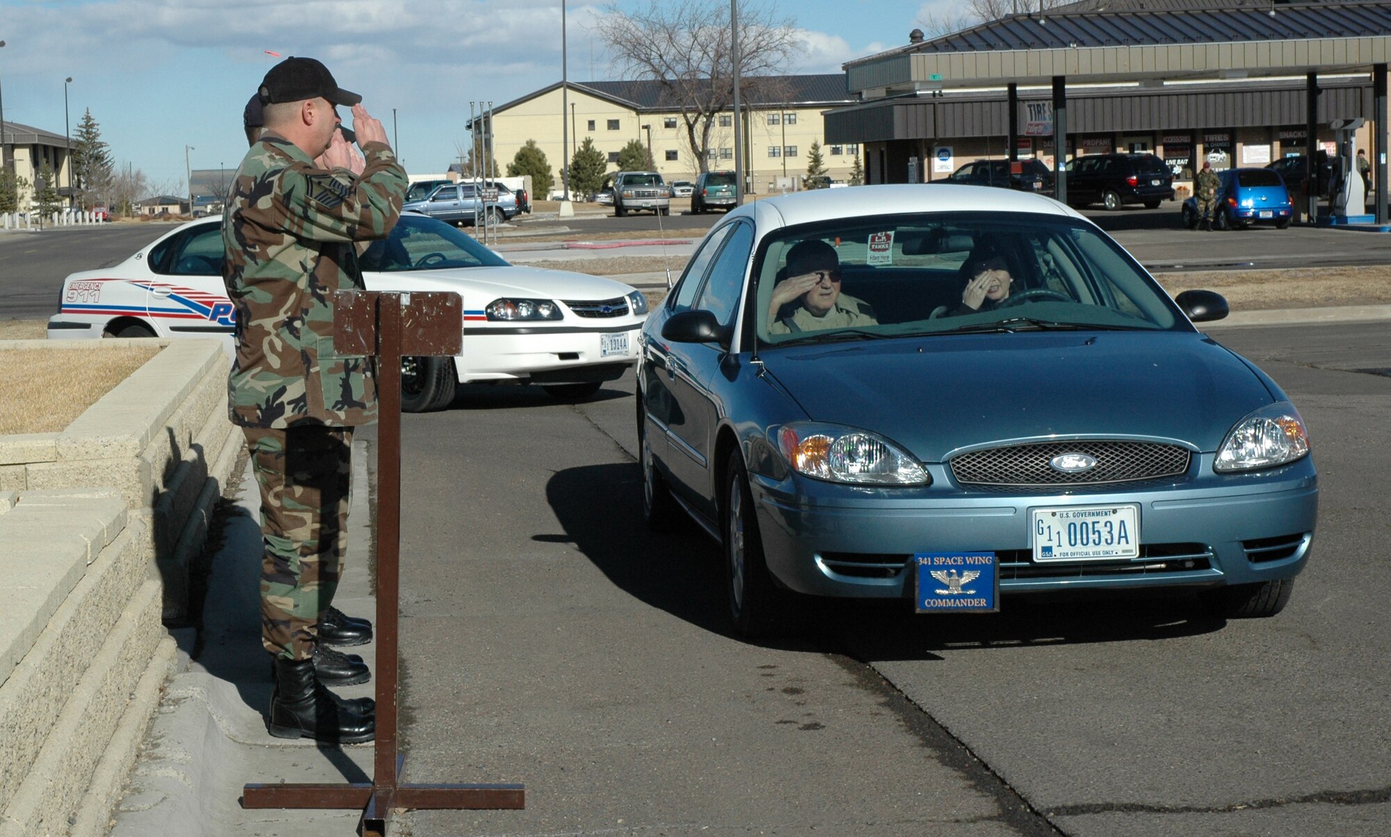 Members of the welcome party salute distinguished visitor retired Gen. Eugene Habiger and the 341st Space Wing Commander Col. Sandy Finan as they arrive at Dormitory 727 for a tour Feb. 21. The welcome party included Senior Master Sgt. Jeffrey Neutzling, 341st Missile Security Forces first sergeant; Master Sgt. Michael Ammons, 341st Mission Support Squadron first sergeant; and Tech. Sgt. Cecil Makin, dormitory manager.