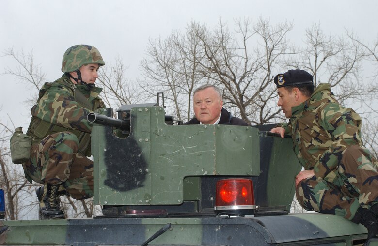 Security Forces Group Commander Col. Steve Asher, right, and Airman 1st Class David McComb, discuss security operations with retired Gen. Eugene Habiger during a demonstration for him Feb. 22 at Camp Grizzly.