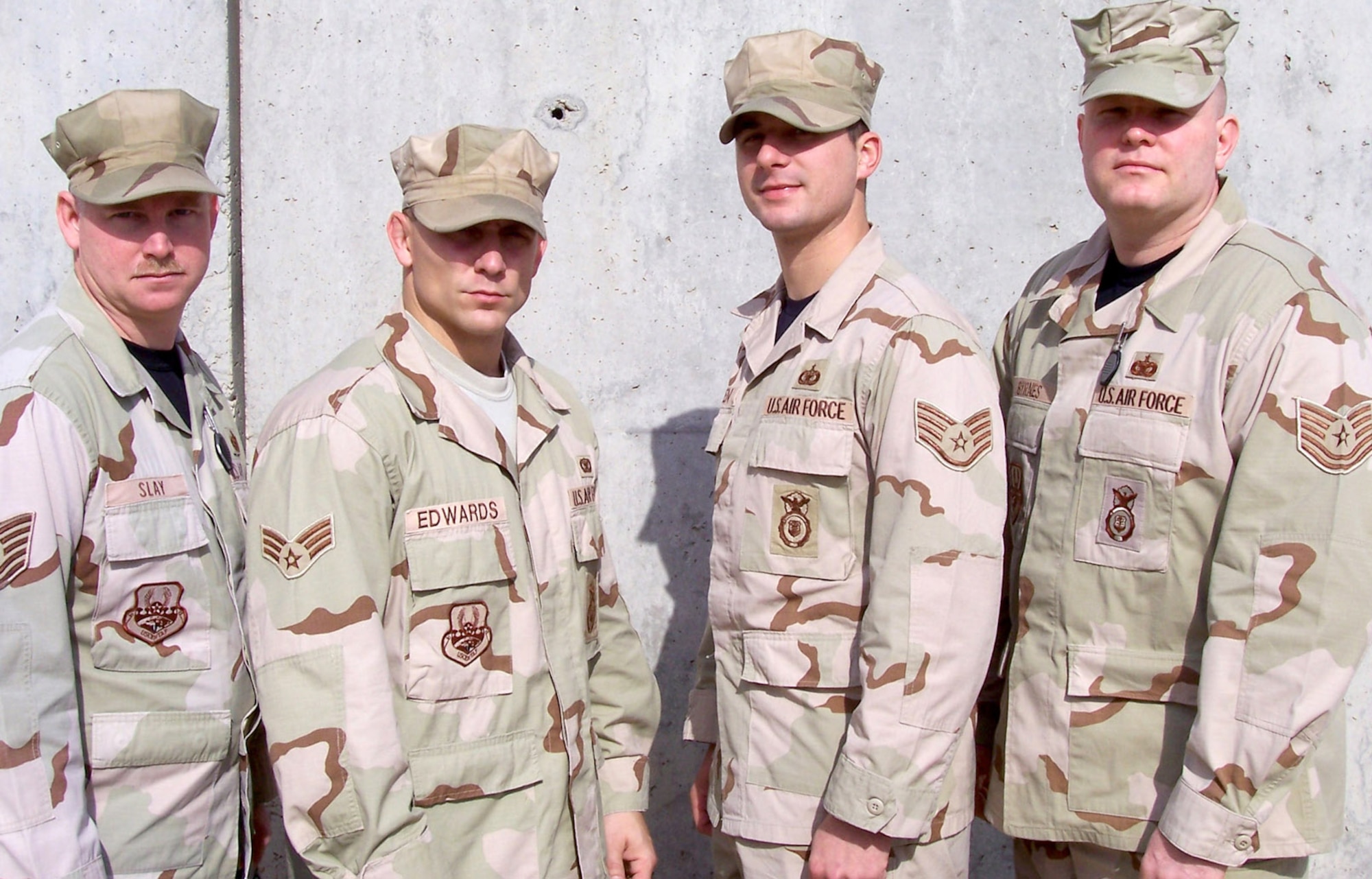 BALAD AIR BASE, Iraq -- Tech. Sgt. Tobby Slay, Senior Airman Will Edwards, Staff Sgt. Nick Allen from the 366th Security Forces Squadron join Tech. Sgt. Robert Byrnes from the 1st SFS at Langley Air Force Base, Va., for a recent group photo at their deployed location in Iraq. Four Gunfighter cops recently earned the 332nd Air Expeditionary Wing’s Tuskegee Team of the Month honor. Air Force photo