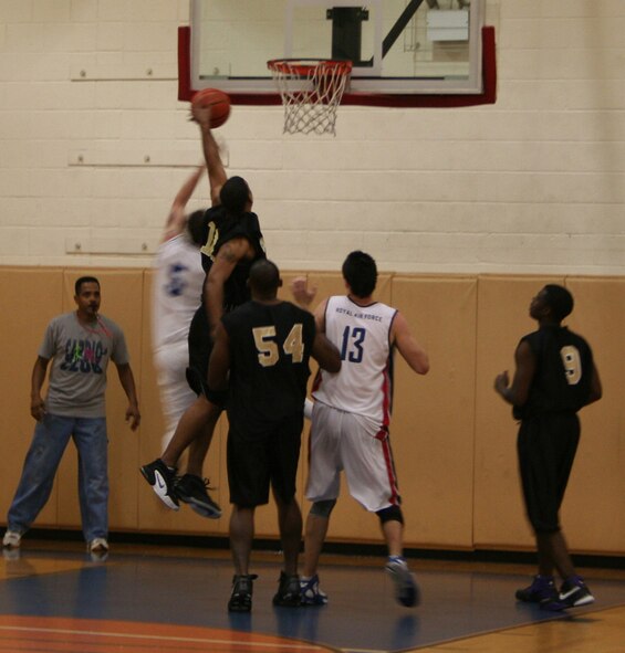 Players battle it out as the Commandos took on the Royal Air Force team in an exhibition game Feb. 22. (U.S. Air Force photo by Jamie Haig)