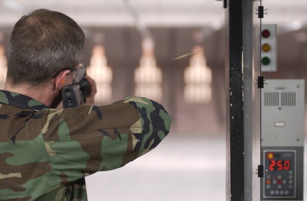 Brass ejects from the rifle of Lt. Col. Doug Spaeth with the 88th Aeromedical Squadron as he shoots from the standing possition. Air Force photo by Spencer P. Lane