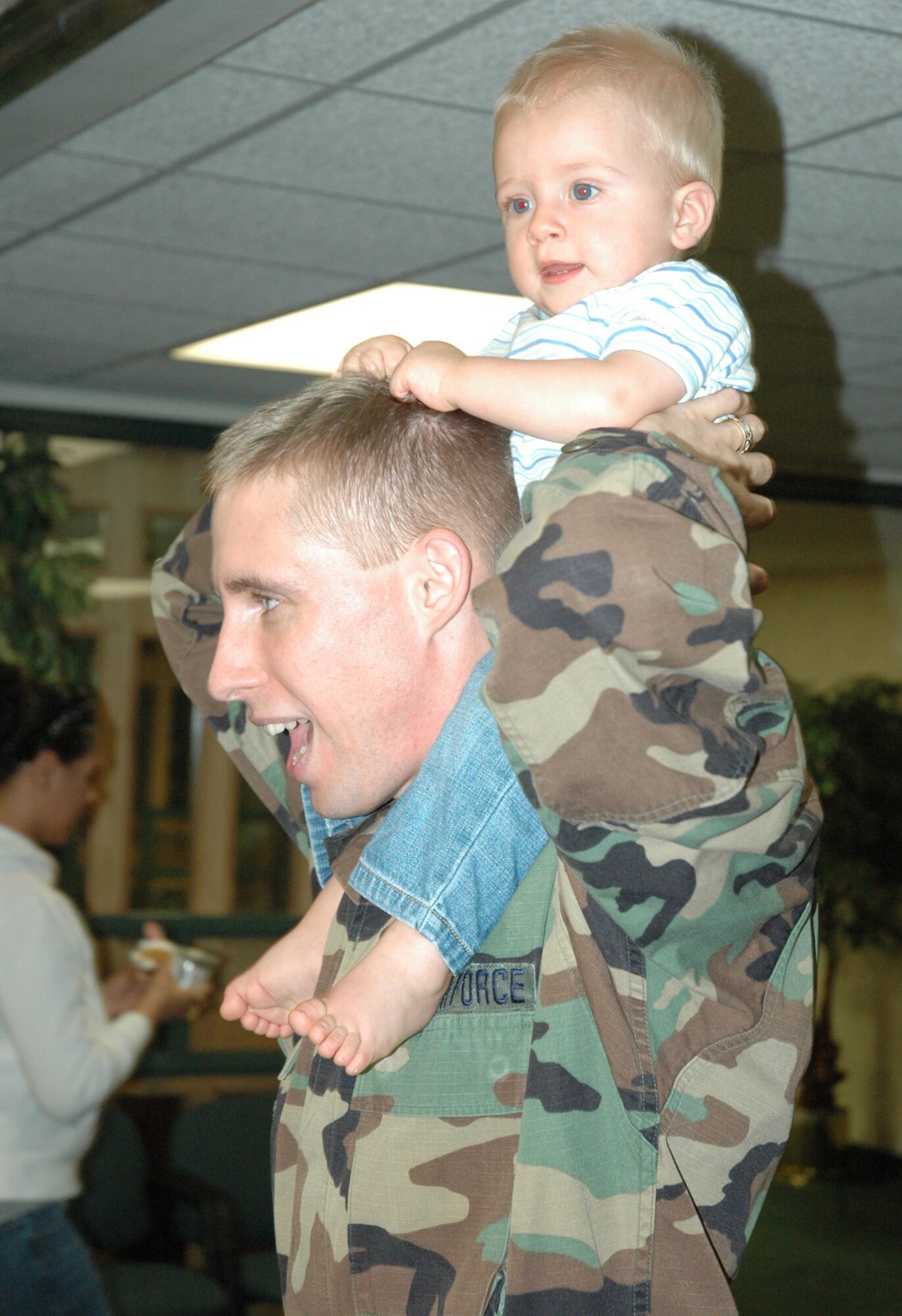 Chaplain (Capt.) Chris Watson, 1st Special Operations Wing chapel, dances with his son during Salute to Families. (U.S. Air Force photo by 1st Lt. Amy Cooper)