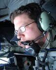 EIELSON AIR FORCE BASE, Alaska--MSgt Cain, KC-135 Boom Operator, 168 Air Refueling Squadron, 168th Air Refueling Wing, Alaska Air National Guard refuels a E-3 Sentry (AWACS) over the arctic. The AWACS is assigned to the 962nd AACS, Elmendorf AFB, Alaska.(U.S. Air Force photo by Master Sgt. Robert Wieland) 