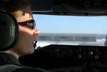 EIELSON AIR FORCE BASE, Alaska--Capt Elisabeth King, KC-135 Aircraft Commander, checks the taxiway for crossing traffic here on 27 Feb, 2006.  Capt King is assigned to the 168th Air Refueling Squadron, 168th Air Refueling Wing, Alaska Air Naitonal Guard. (U.S. Air Force photo by Master Sgt. Robert Wieland) 